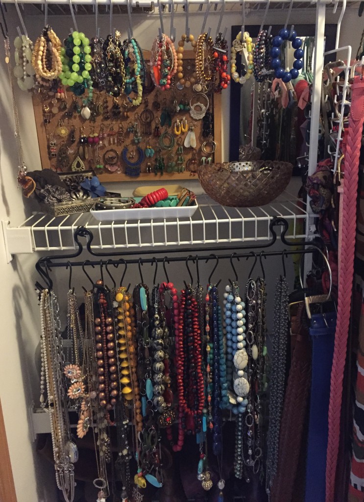 Necklaces are all on the bottom organized by colour, bracelets on top and my little glass trays hold bangles, brooches and such!