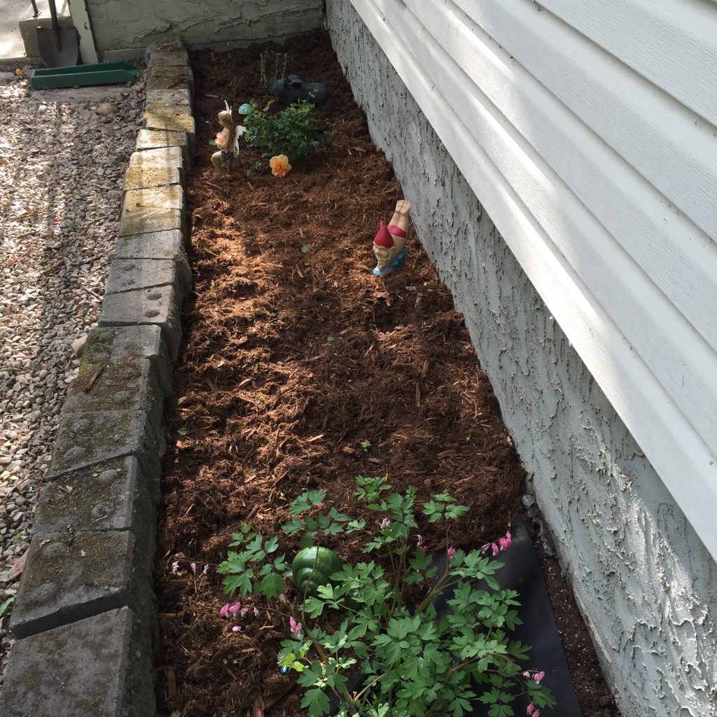Flower bed upgraded to fairy garden with ...