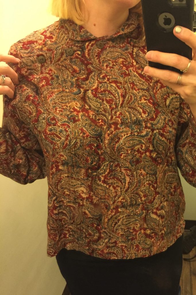 There was a great $1 rack and I so wanted to find something!  I thought this top had potential with its interesting buttons but instead I looked like a monk.  Pass.