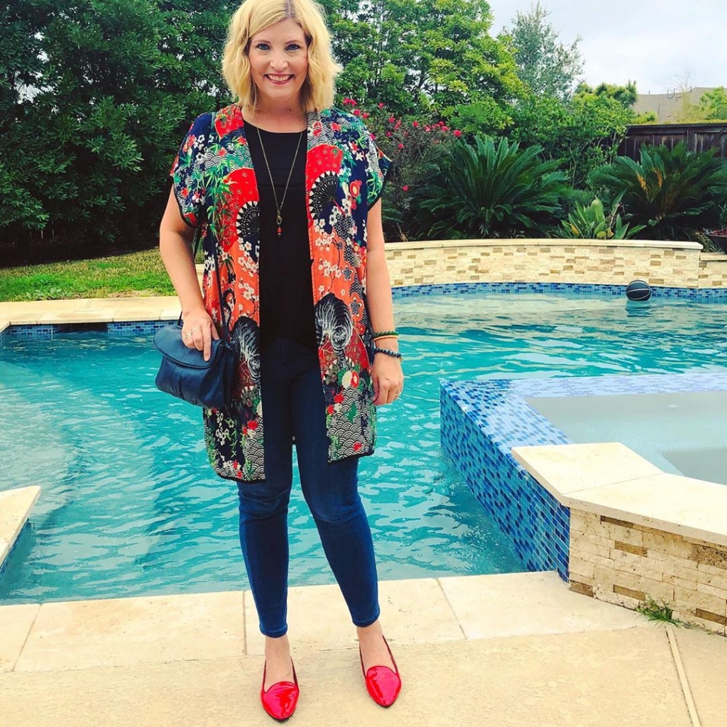 Black top, jeans, printed kimono and red pointy flats to answer the question: are prints still stylish?